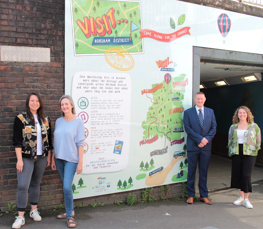 Visit Horsham Albion Way walkway panels with Whistlestop Arts Annalees Lim and Luna Russell, Cllr Tony Hogben and Lisa Brace from Bold PR (1)
