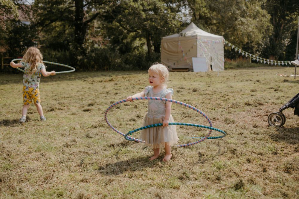 Children hula-hooping Flora Westbrook Photography