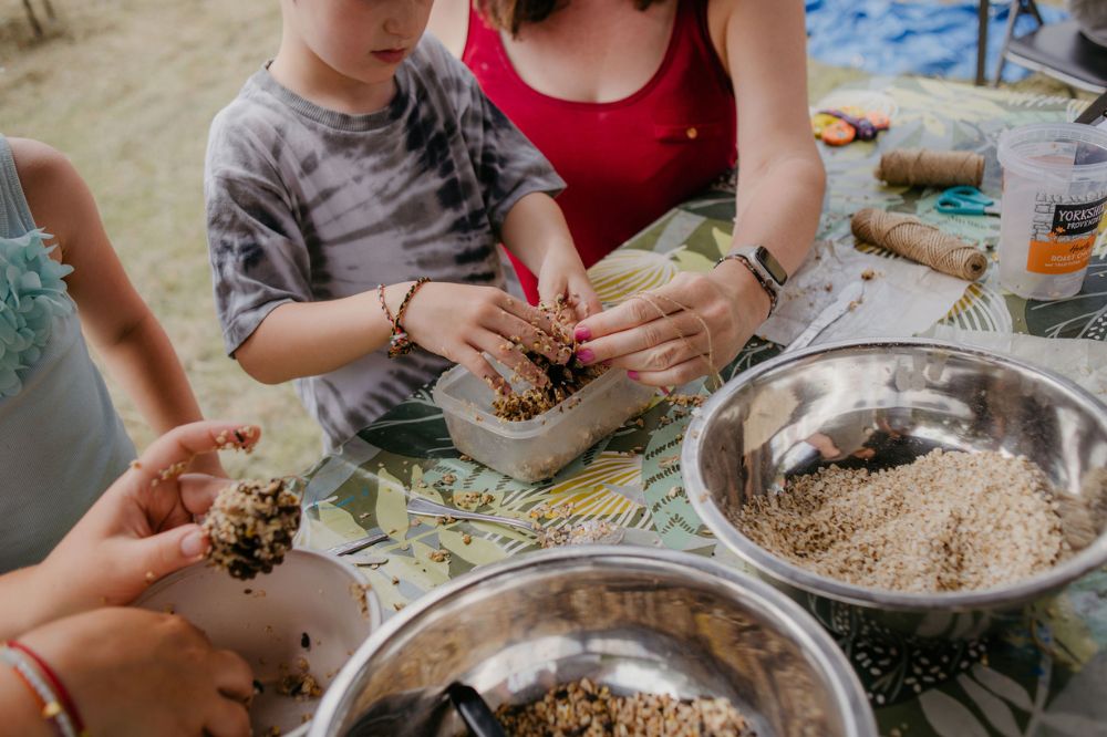 Children enjoying messy play at a table