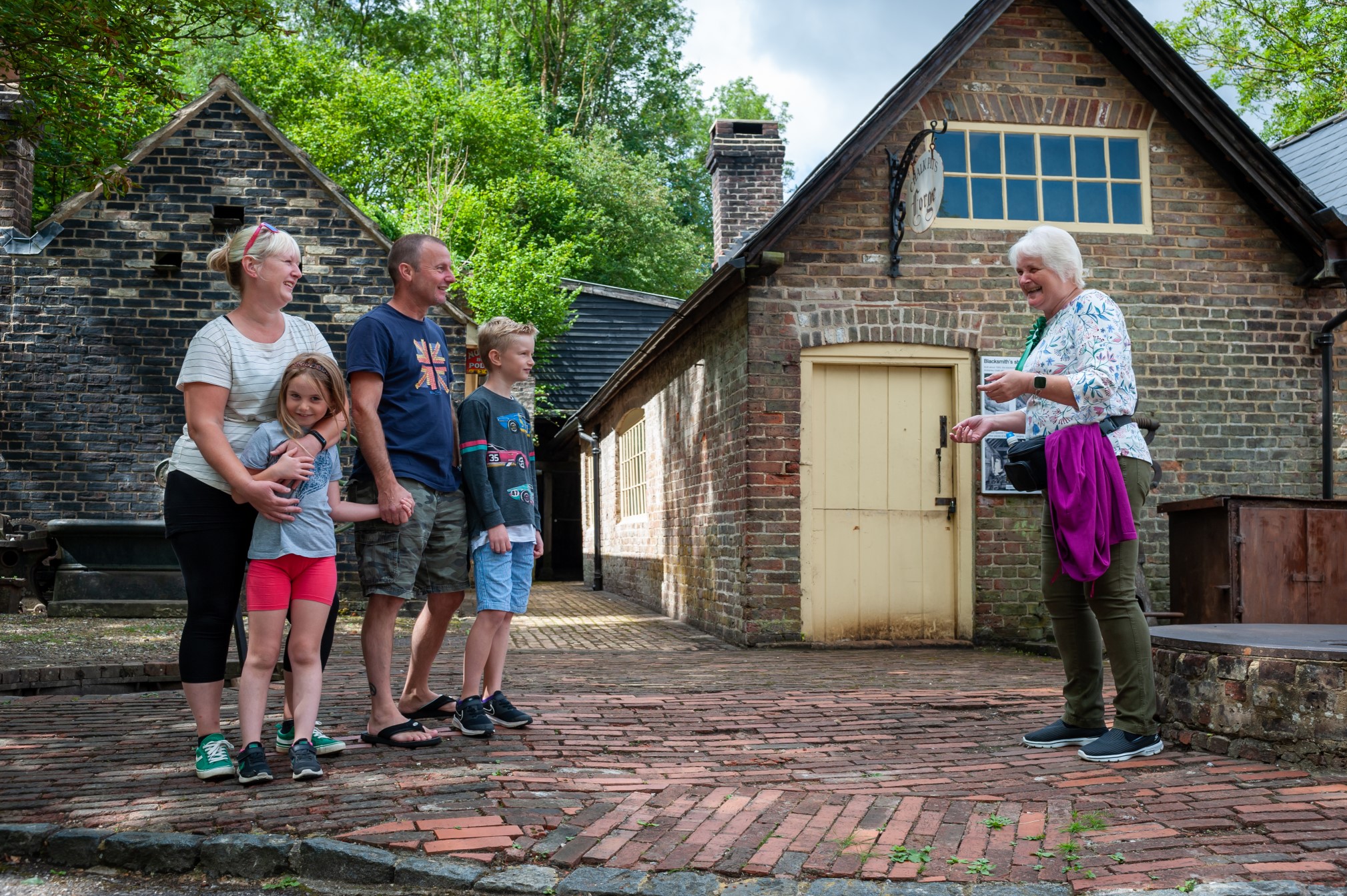 Family being welcomed to Amberly museum grounds