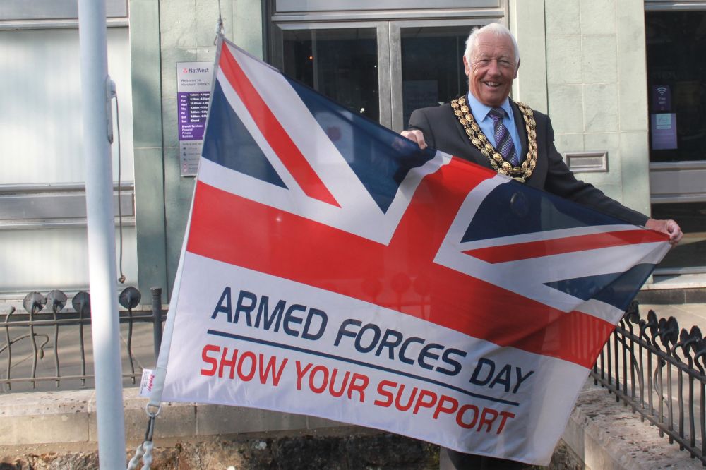 Cllr Skipp with the Armed Forces Day flag