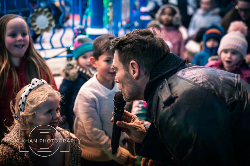 John Partridge performing at the 2023 Christmas party event