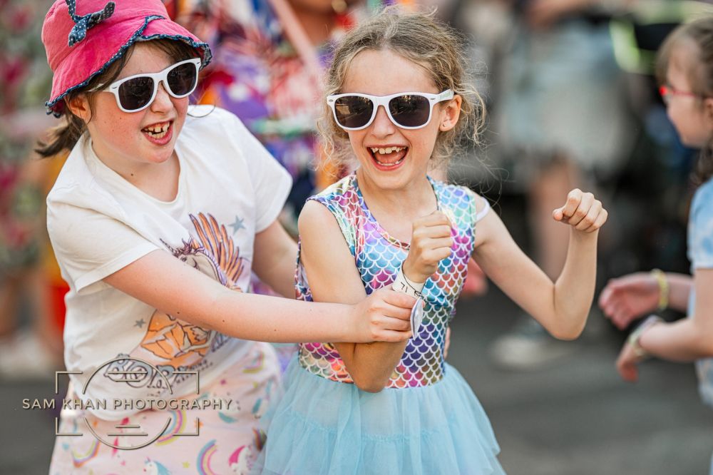 Two girls wearing sunglasses