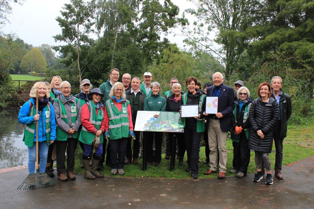 Horsham District Council Cabinet Member for Leisure and Culture Cllr David Skipp with Friends of Horsham Park volunteers and the Council's Parks and Countryside team celebrate the award